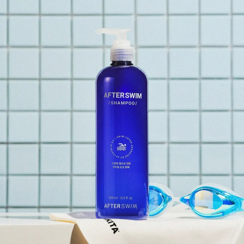 AfterSwim Pool Shampoo 500ml bottle by a swimming pool